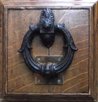 As black as a Newgate's knocker
